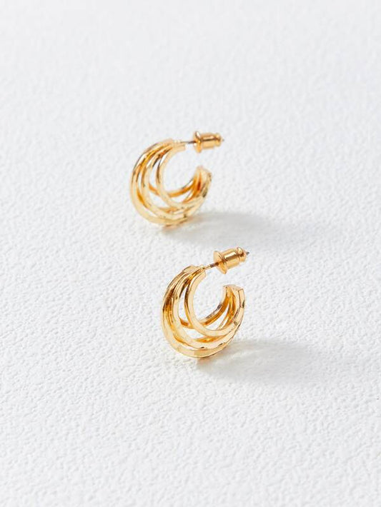 Open gold hoop earrings on white background – Gillian & Co