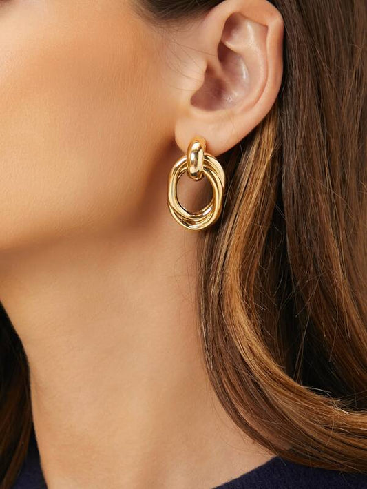 Geometric drop earrings in yellow gold on model – Gillian & Co