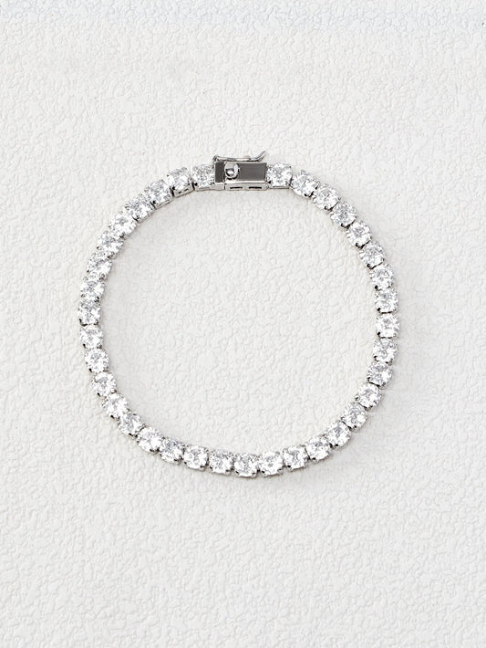 Silver cubic zirconia tennis bracelet flat lay – Gillian & Co