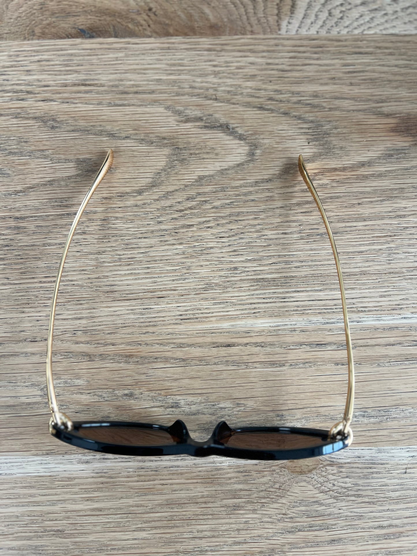 Close-up of black oval sunglasses – women’s fashion accessory