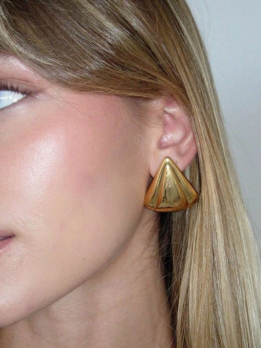 Gold-tone stainless steel earrings on model – trendy jewellery South Africa